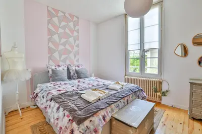 Un ou plusieurs lits dans un hébergement de l'établissement La maison du Bonheur