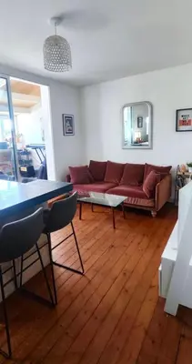 Coin salon dans l'établissement Charmant appartement cosy en plein centre
