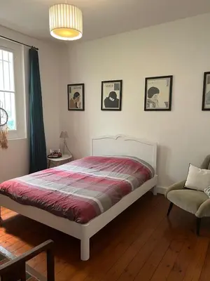 Un ou plusieurs lits dans un hébergement de l'établissement Charmant appartement cosy en plein centre
