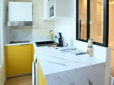 Cuisine ou kitchenette dans l'établissement Le Petit Jacques Cognac Studio