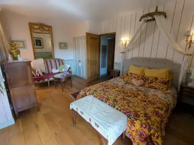Un ou plusieurs lits dans un hébergement de l'établissement Chambre d'Hôtes La Grenade Bleue