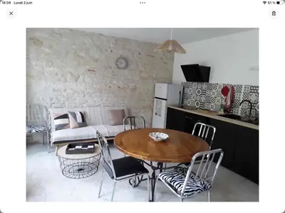 Coin salon dans l'établissement Gîte La Maison d Hélène