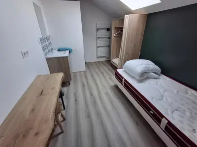 Un ou plusieurs lits dans un hébergement de l'établissement Gîte au milieu de la campagne