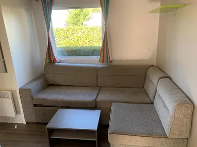 Coin salon dans l'établissement Mobil home Bahia DUO Prenium