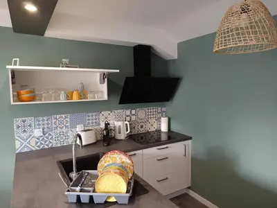 Cuisine ou kitchenette dans l'établissement Hébergement quartier historique