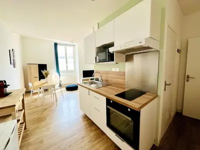 Cuisine ou kitchenette dans l'établissement Le Ferte - Coeur de ville