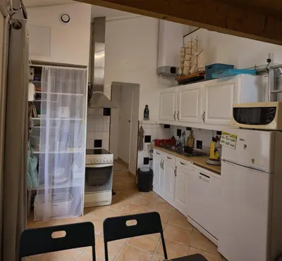 Cuisine ou kitchenette dans l'établissement Le refuge de la Fée - centre et plage