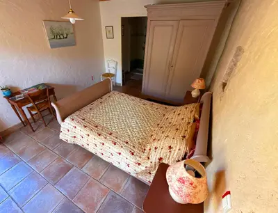 Un ou plusieurs lits dans un hébergement de l'établissement Chambre d'hôtes Les Bleuets