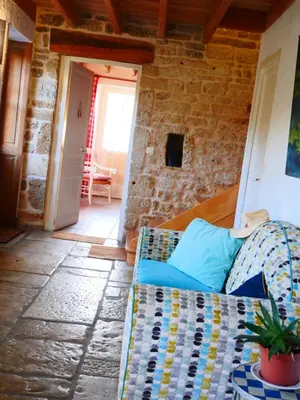 Coin salon dans l'établissement Chambre d'hôtes Les Bleuets