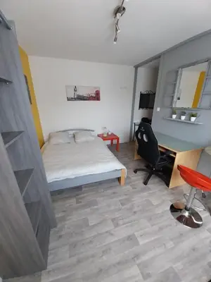 Un ou plusieurs lits dans un hébergement de l'établissement Studio Beauséjour