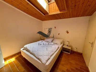 Un ou plusieurs lits dans un hébergement de l'établissement L'Océane - Maison au calme avec terrasse, centre de Bourg