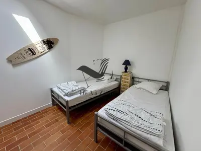 Un ou plusieurs lits dans un hébergement de l'établissement L'Océane - Maison au calme avec terrasse, centre de Bourg