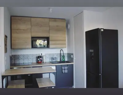 Cuisine ou kitchenette dans l'établissement T2 Cosy avec Terrasse et Jardinet