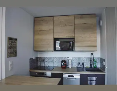 Cuisine ou kitchenette dans l'établissement T2 Cosy avec Terrasse et Jardinet