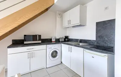Cuisine ou kitchenette dans l'établissement Appartement Proche Plage