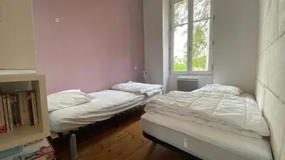 Un ou plusieurs lits dans un hébergement de l'établissement Maison en hyper centre, à 50 mètres de la plage