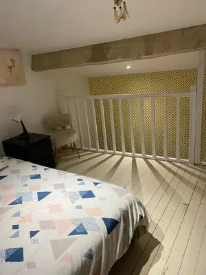 Un ou plusieurs lits dans un hébergement de l'établissement Maison calme en campagne