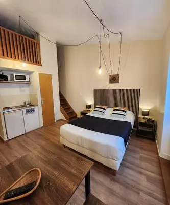 Un ou plusieurs lits dans un hébergement de l'établissement Les Apparts du Valois, Cognac Centre