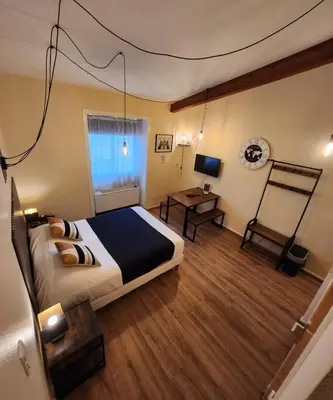 Un ou plusieurs lits dans un hébergement de l'établissement Les Apparts du Valois, Cognac Centre