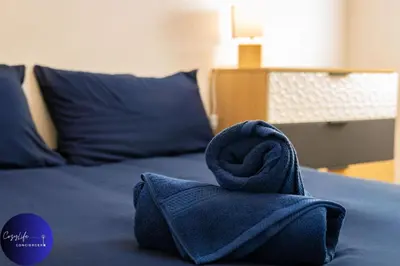 Un ou plusieurs lits dans un hébergement de l'établissement La Chrysalide by CozyLife - Centre Ville