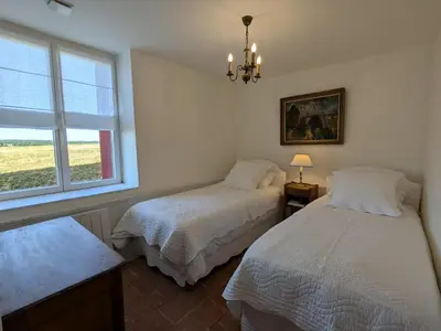 Un ou plusieurs lits dans un hébergement de l'établissement Maison authentique avec piscine et jardin privé à Abzac - FR-1-653-278