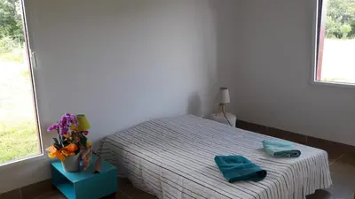 Un ou plusieurs lits dans un hébergement de l'établissement Maison bois à la campagne