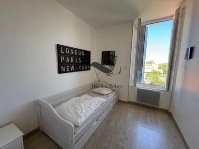 Un ou plusieurs lits dans un hébergement de l'établissement ARISTIDE 4 - Appartement idéalement située