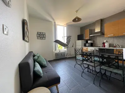 Cuisine ou kitchenette dans l'établissement ARISTIDE 4 - Appartement idéalement située