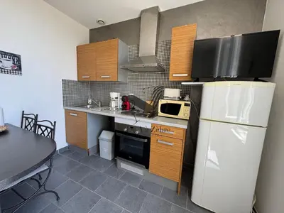 Cuisine ou kitchenette dans l'établissement ARISTIDE 5 - Appartement idéalement situé