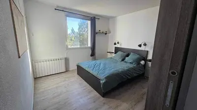 Un ou plusieurs lits dans un hébergement de l'établissement Appartement proche Futuroscope
