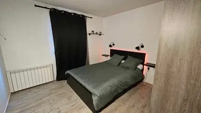 Un ou plusieurs lits dans un hébergement de l'établissement Appartement proche Futuroscope