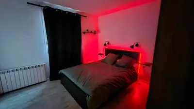 Un ou plusieurs lits dans un hébergement de l'établissement Appartement proche Futuroscope