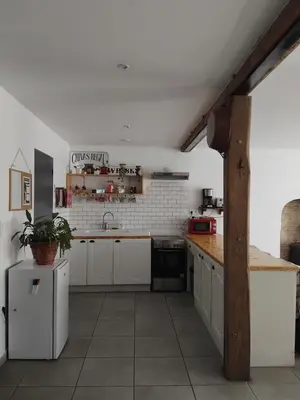 Cuisine ou kitchenette dans l'établissement Grand appartement