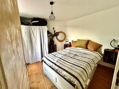 Un ou plusieurs lits dans un hébergement de l'établissement Charmante maison de campagne