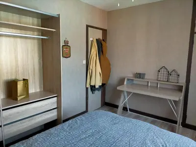 Un ou plusieurs lits dans un hébergement de l'établissement Maison familiale 4 chambres, proche commerces et plage