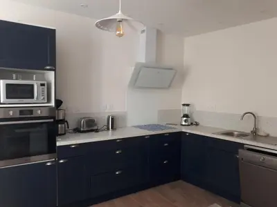 Cuisine ou kitchenette dans l'établissement Le gîte Les clématites