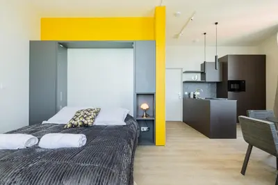 Un ou plusieurs lits dans un hébergement de l'établissement Appartement chic vue imprenable sur le vieux port