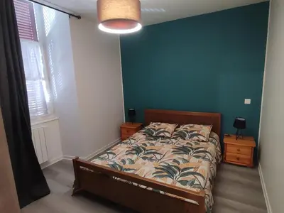 Un ou plusieurs lits dans un hébergement de l'établissement Appartement de ville