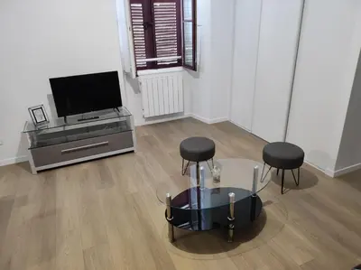 Télévision ou salle de divertissement dans l'établissement Appartement de ville