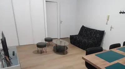 Coin salon dans l'établissement Appartement de ville