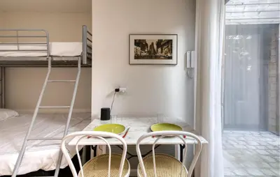 Un ou plusieurs lits dans un hébergement de l'établissement Appartement Proche Plage