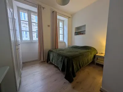 Un ou plusieurs lits dans un hébergement de l'établissement Appartement du Cordouan, lumineux, calme et central a 100m du marché
