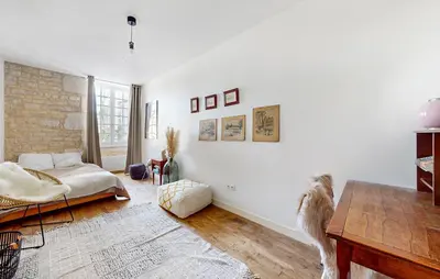Un ou plusieurs lits dans un hébergement de l'établissement Ferienhaus mit Charakter und Terrasse in perfekter Lage