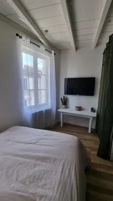 Un ou plusieurs lits dans un hébergement de l'établissement Romantic Cognac Studio