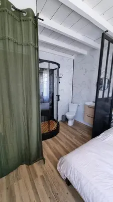 Un ou plusieurs lits dans un hébergement de l'établissement Romantic Cognac Studio