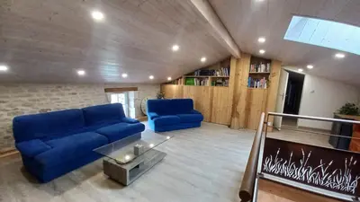 Coin salon dans l'établissement Gîte familial Marais Poitevin Les glycines