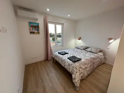 Un ou plusieurs lits dans un hébergement de l'établissement Villa Champs et Mer