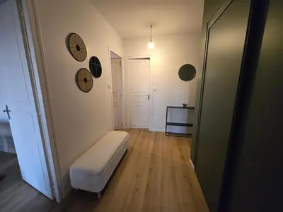 Un ou plusieurs lits dans un hébergement de l'établissement L'appartement de Julien