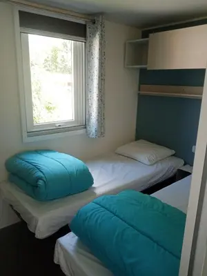 Un ou plusieurs lits dans un hébergement de l'établissement camping ile aux loisirs