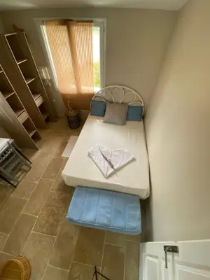 Un ou plusieurs lits dans un hébergement de l'établissement La chambre solaire à la ferme